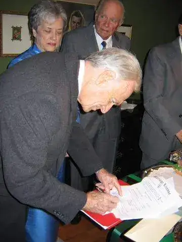 Bob signing the marriage certificate